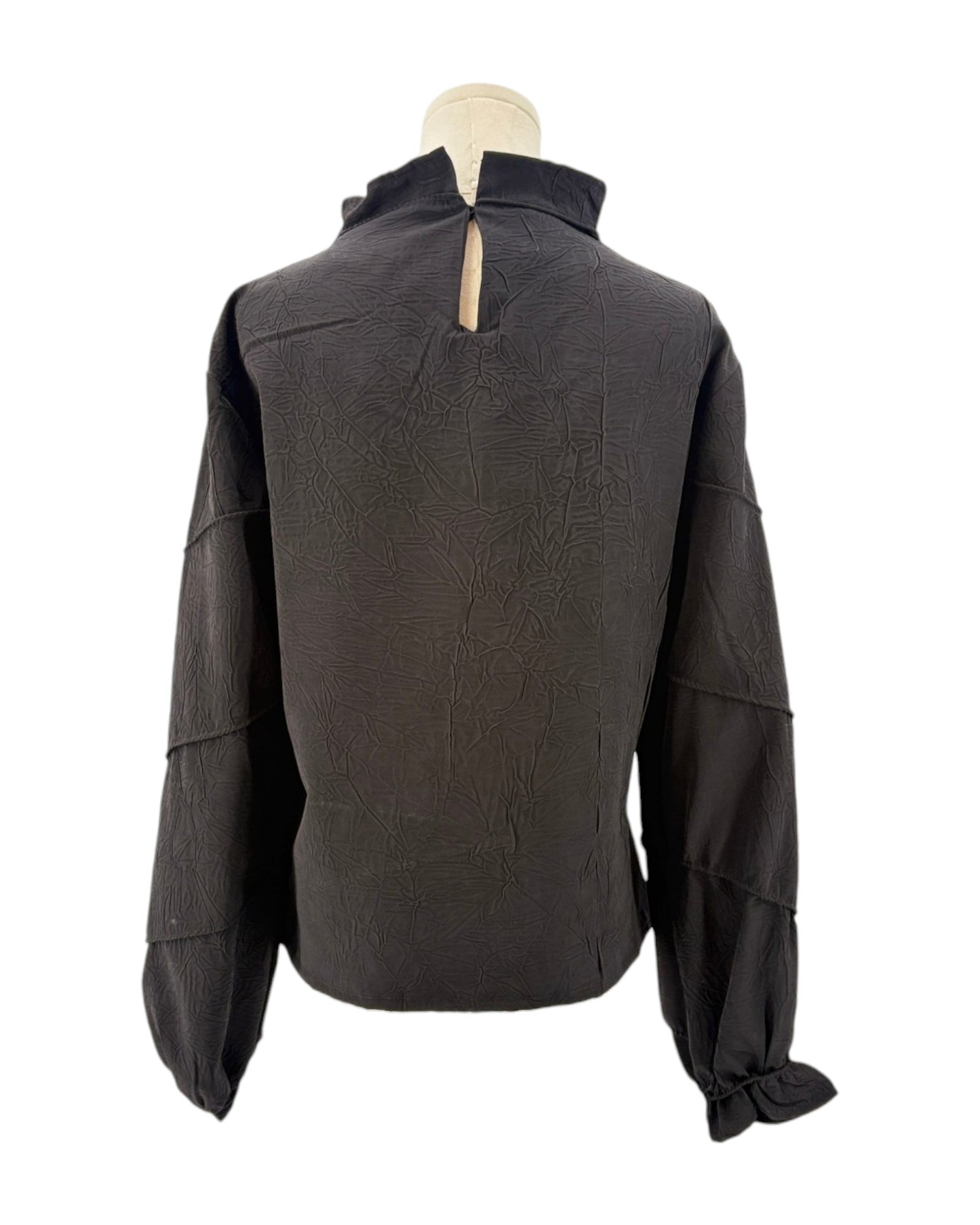 Rohe black long-sleeve shirt on a mannequin against a white background