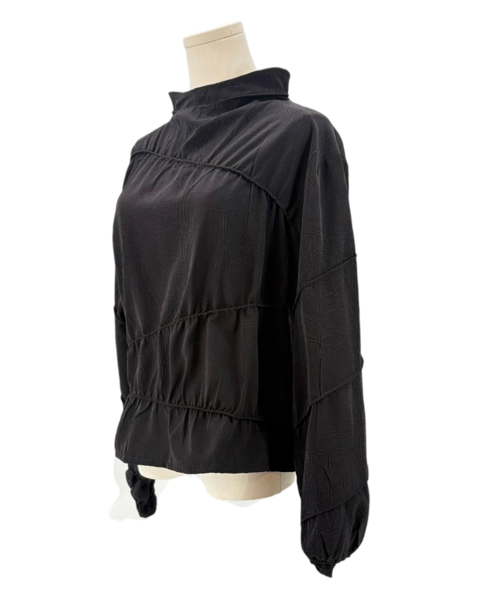 Rohe black long-sleeve shirt on a mannequin against a white background