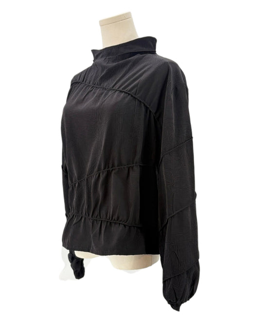 Rohe black long-sleeve shirt on a mannequin against a white background