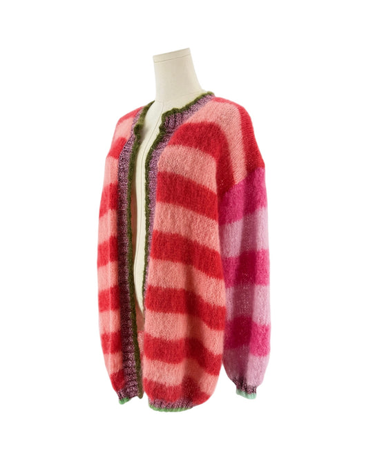 A fuzzy knit sweater with horizontal wavy stripes in shades of red, pink, and coral, displayed on a mannequin from the back against a plain white background.