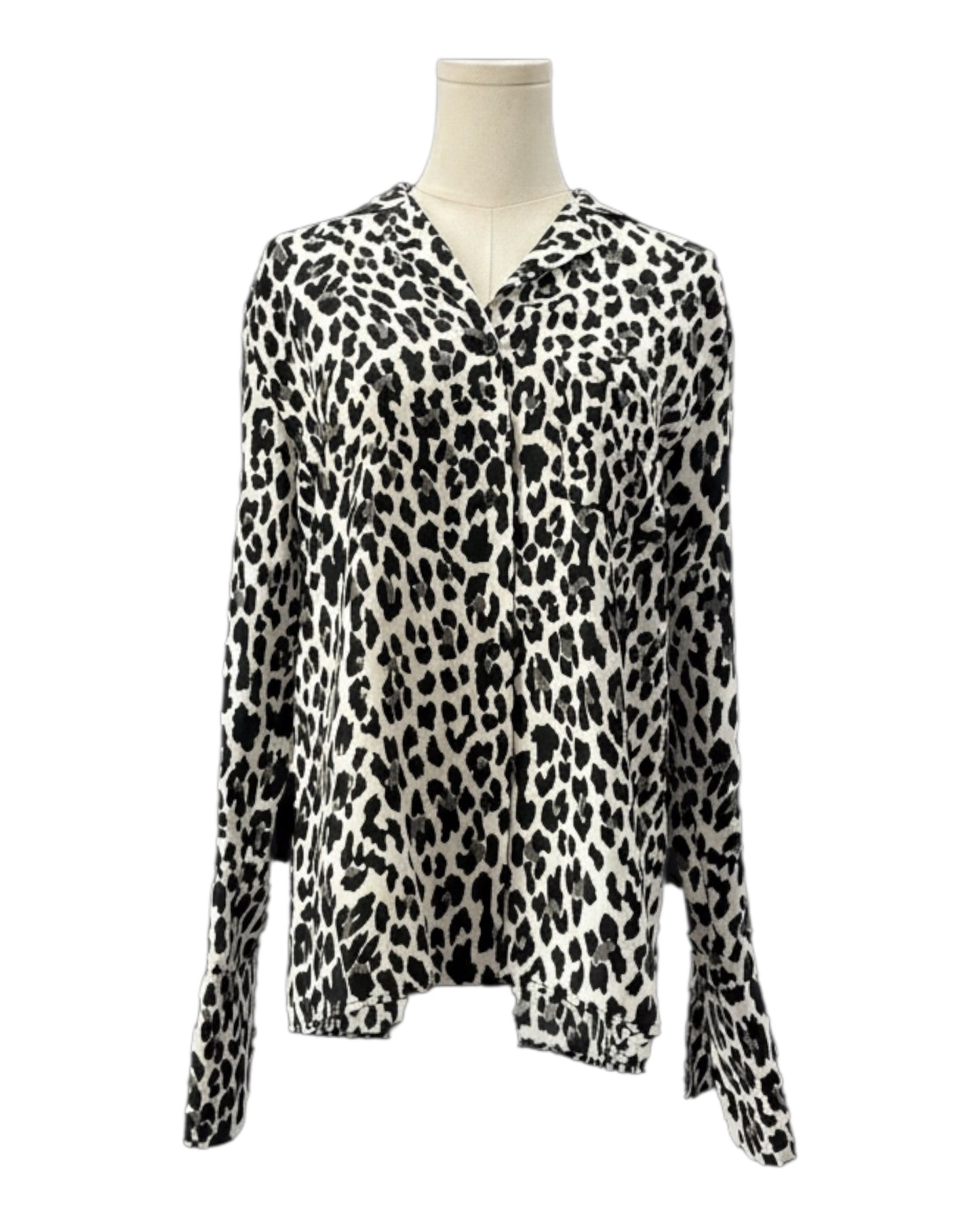 Leopard print blouse on a mannequin against a white background