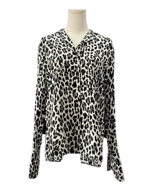Leopard print blouse on a mannequin against a white background
