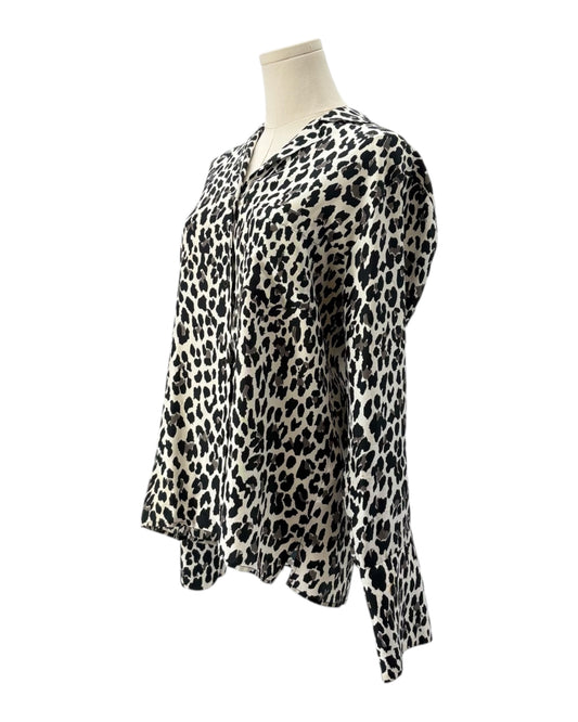 Leopard print blouse on a mannequin against a white background