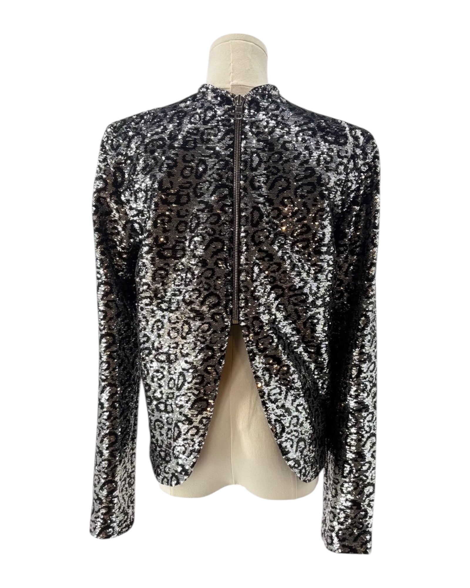 Leopard print top on a mannequin against a white background