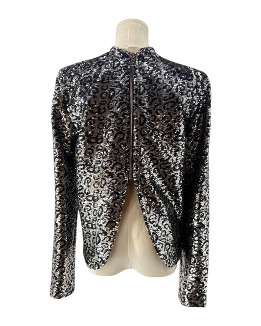 Leopard print top on a mannequin against a white background