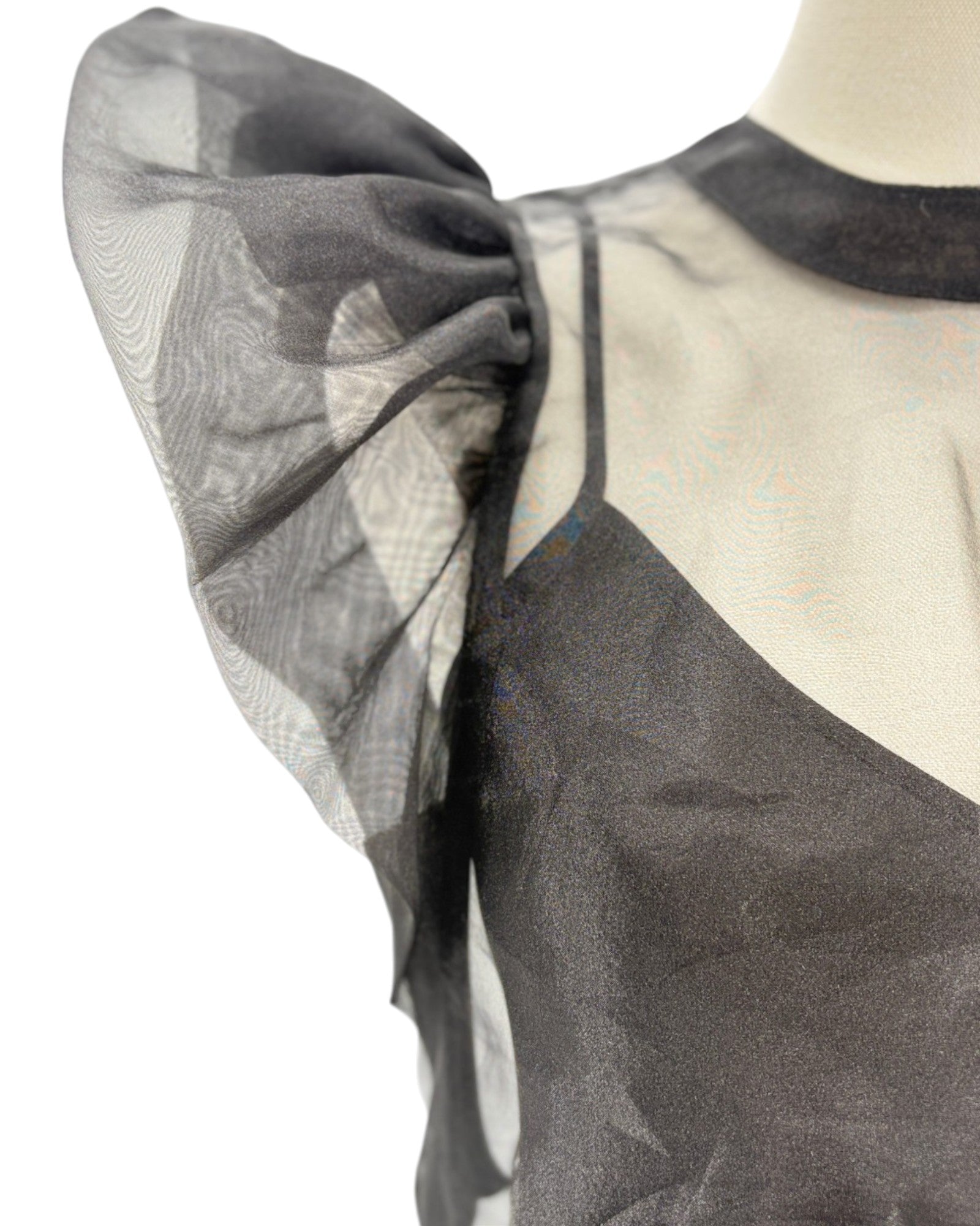 Black and white patterned fabric on a mannequin with sheer overlay