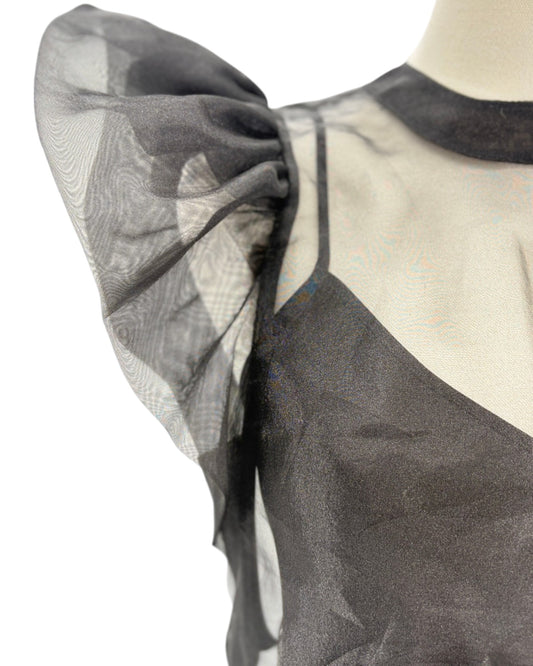 Black and white patterned fabric on a mannequin with sheer overlay
