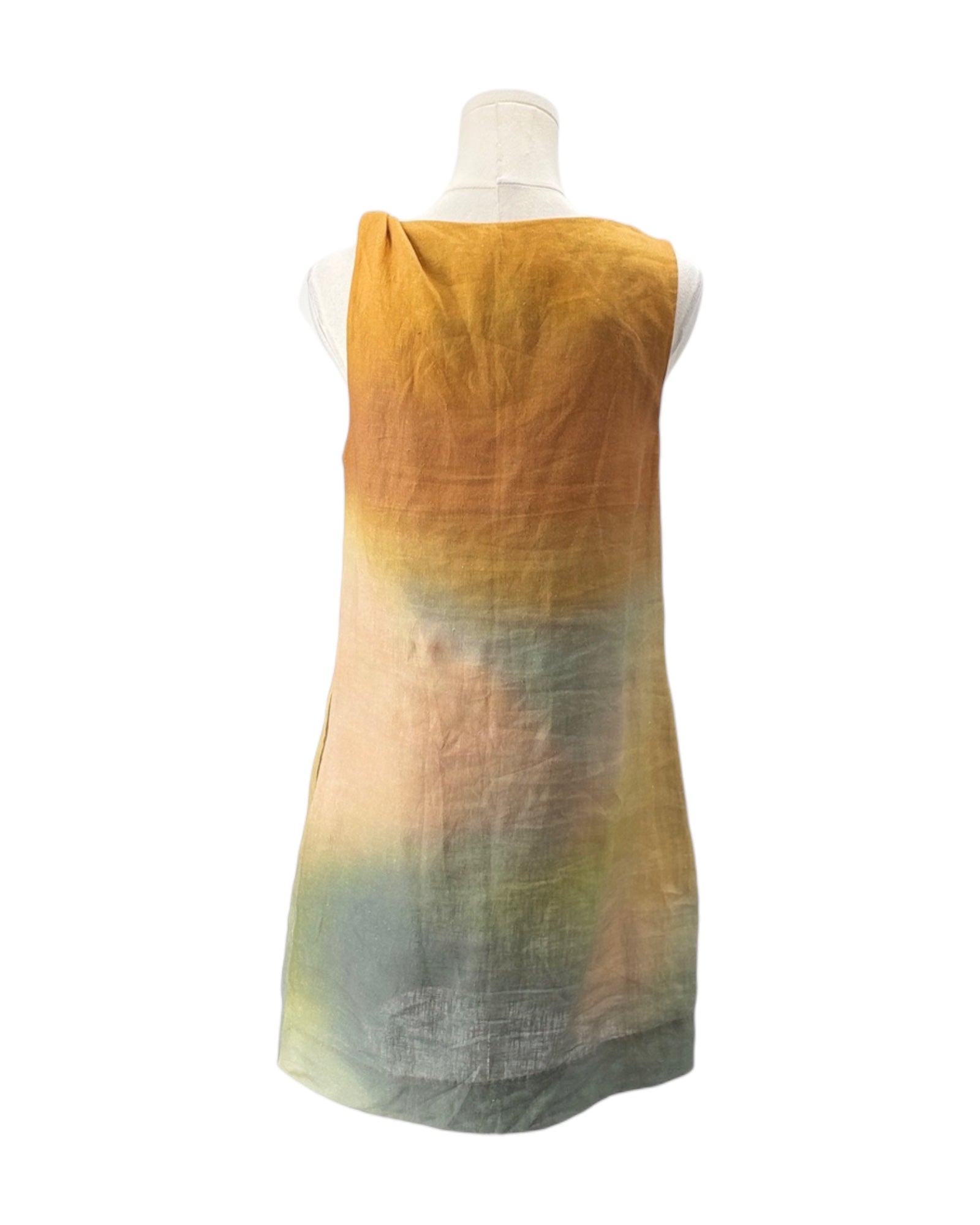 Mannequin wearing a sleeveless dress with a gradient of yellow, green, and pink on a white background