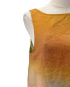 Ombre yellow to green sleeveless dress on a mannequin with a white background