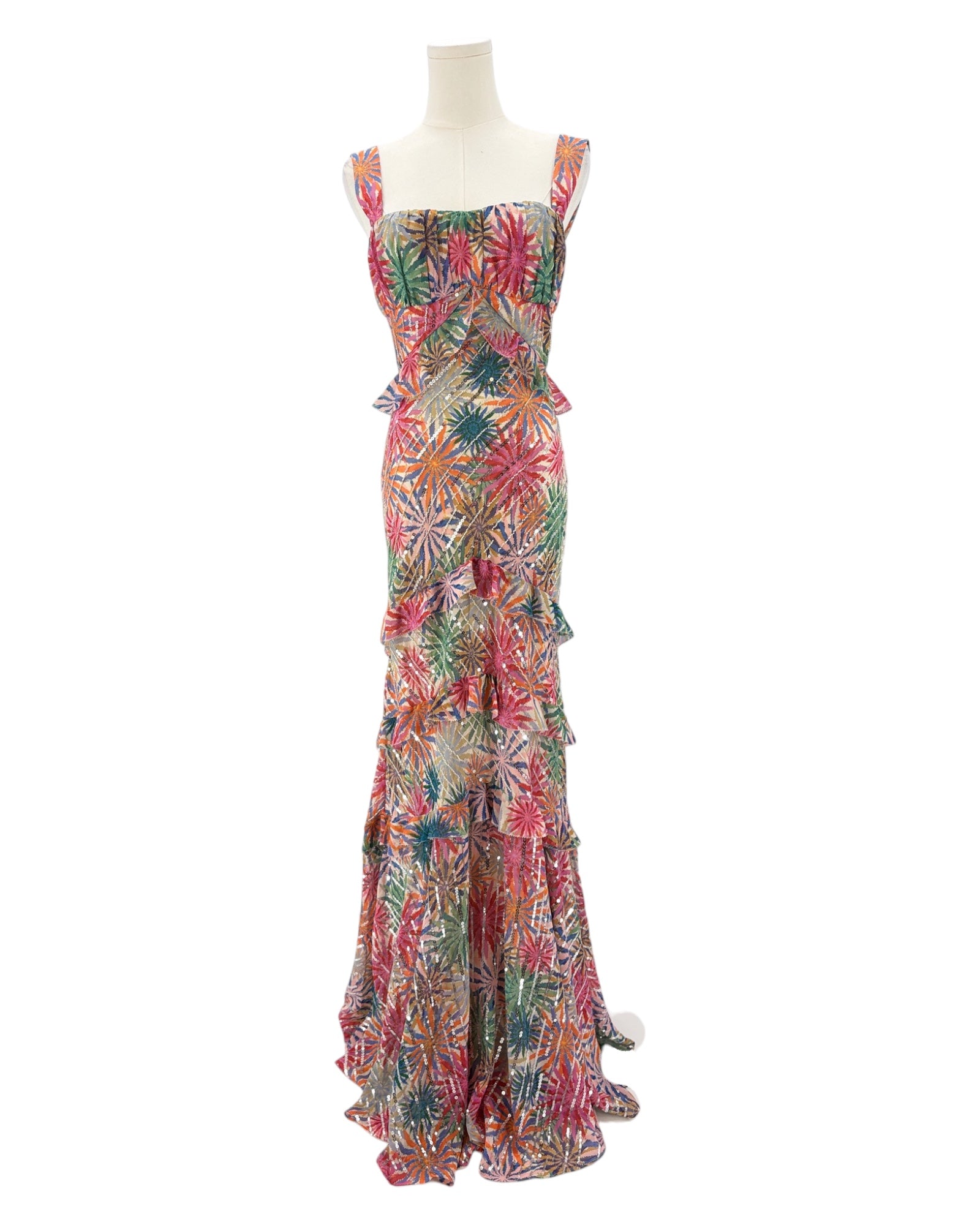 Colorful floral dress on a mannequin against a white background