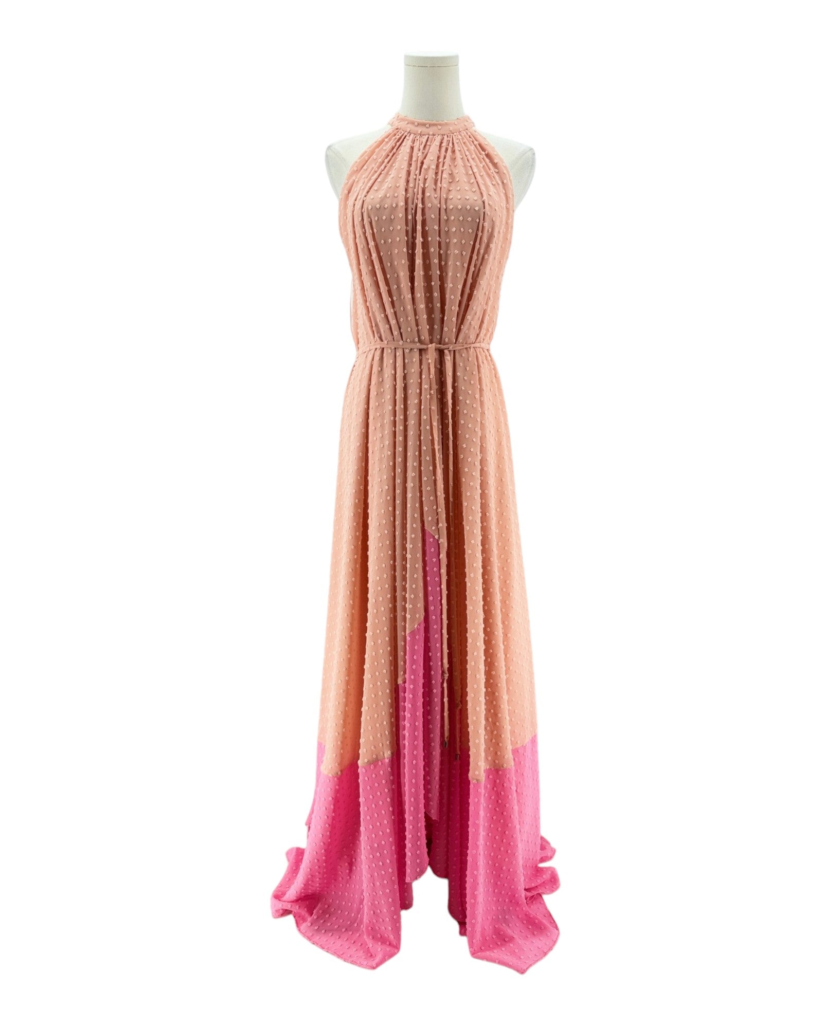 Long dress with gradient color from pink to orange on a mannequin against a white background