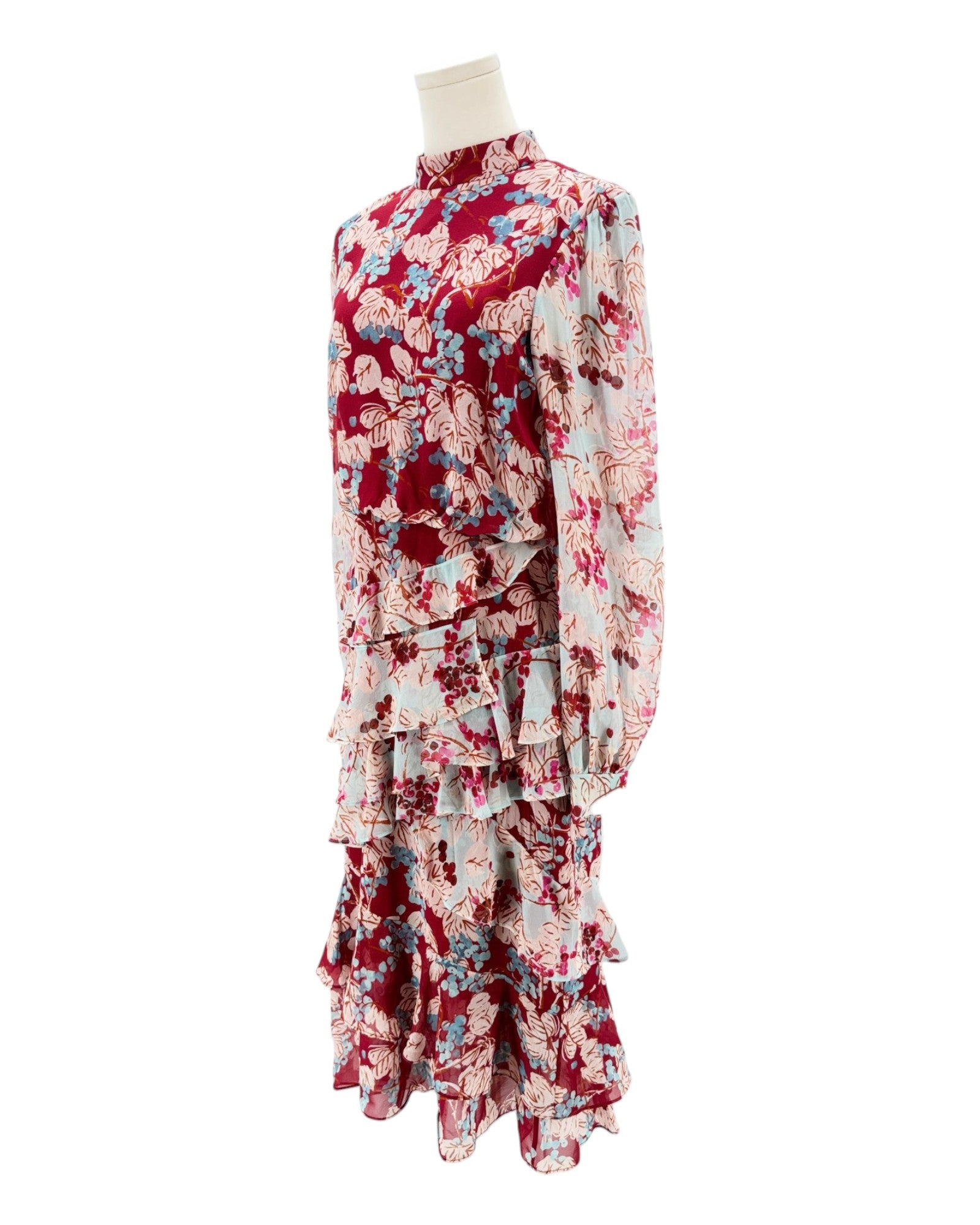 Floral dress on a mannequin against a white background