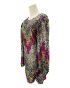 Multicolored sequin dress on a mannequin against a white background