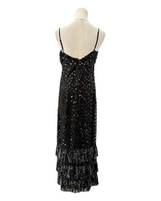 Black sequin dress on a mannequin against a white background