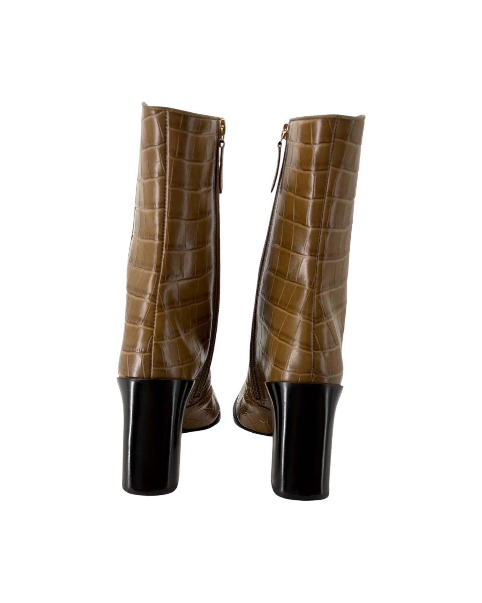 Brown crocodile-patterned boots with black soles on a white background