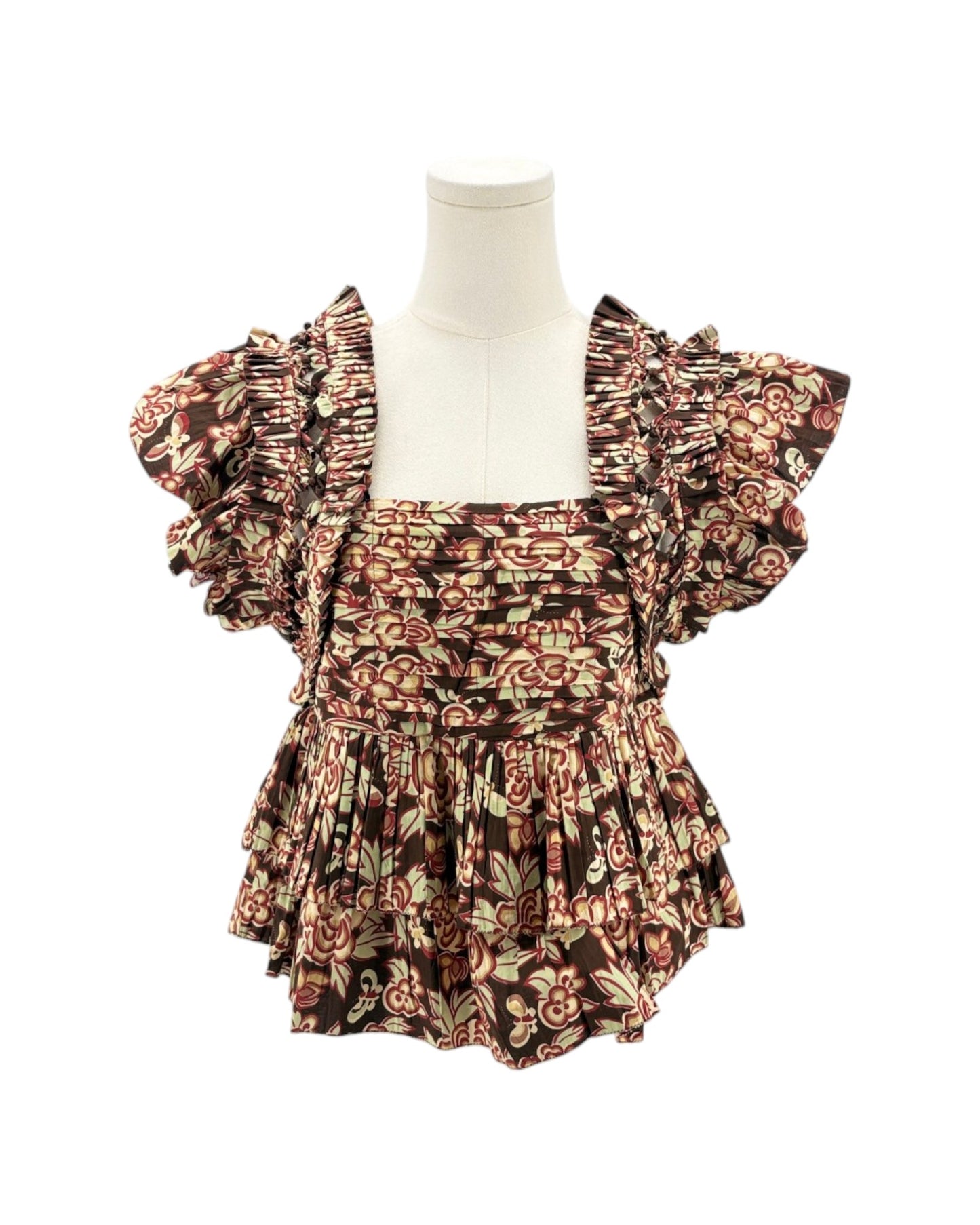 Floral patterned fabric with ruffled details on a white background