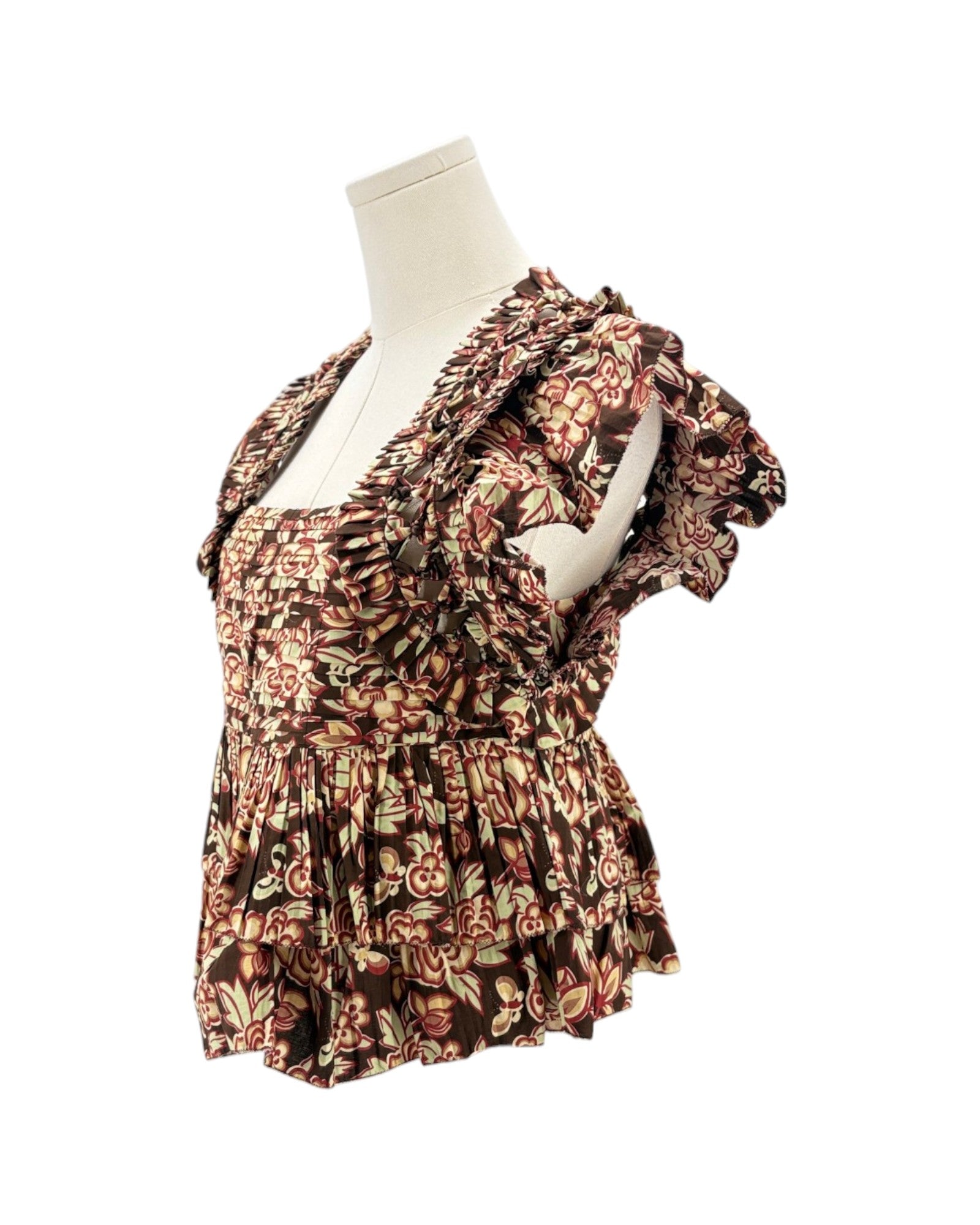 Floral patterned dress on a mannequin against a white background