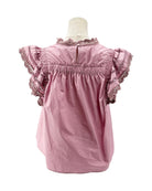 Pink blouse with ruffled sleeves on a mannequin against a white background