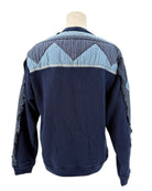 Sea NY navy blue sweater with a patchwork pattern on a mannequin against a white background