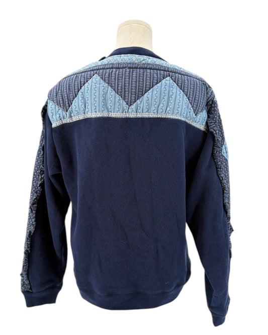 Sea NY navy blue sweater with a patchwork pattern on a mannequin against a white background