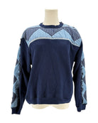 Sea NY navy blue sweater with a patchwork pattern on a mannequin against a white background