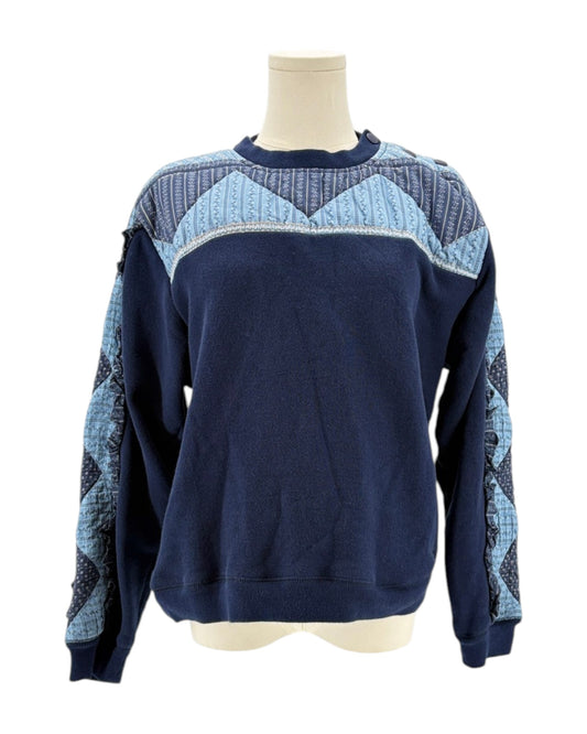 Sea NY navy blue sweater with a patchwork pattern on a mannequin against a white background