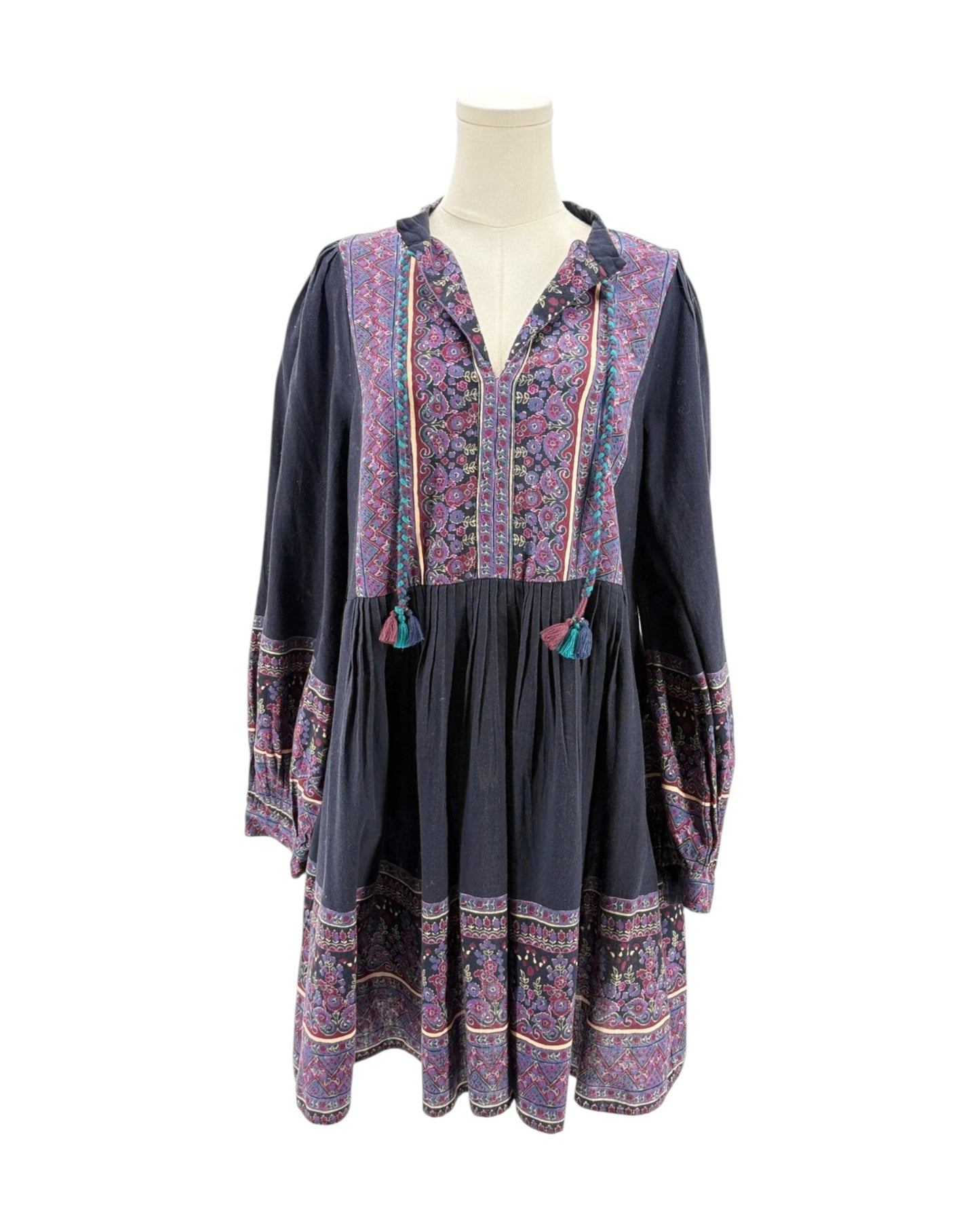 Floral patterned dress on a mannequin against a white background