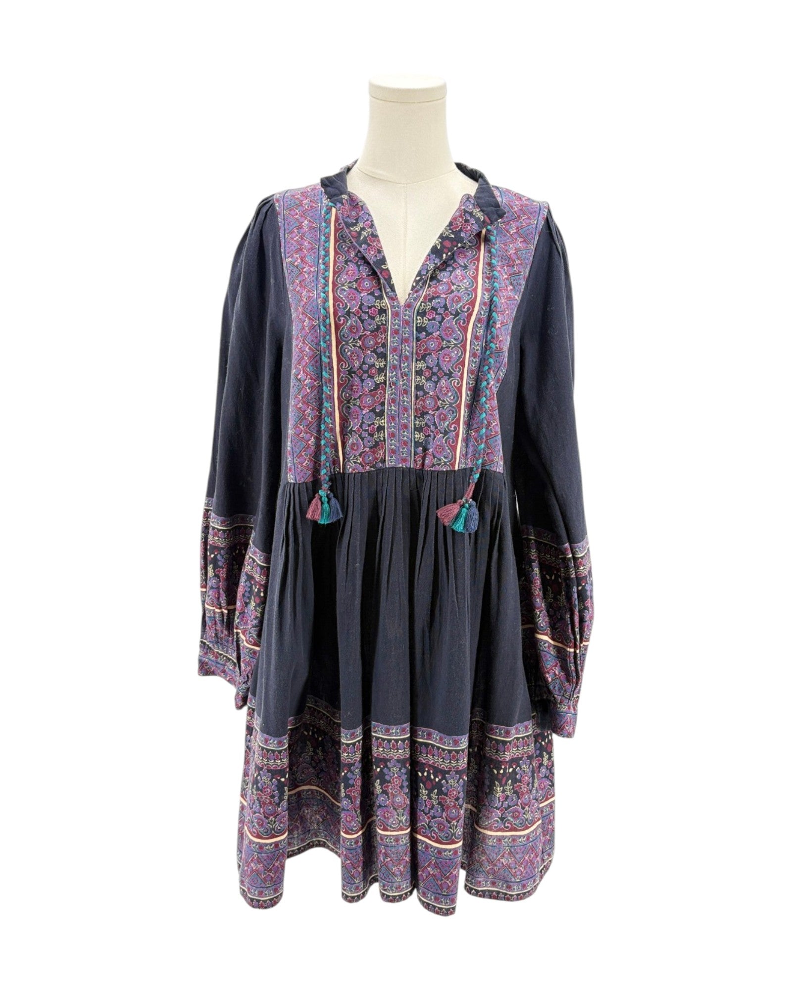 Floral patterned dress on a mannequin against a white background
