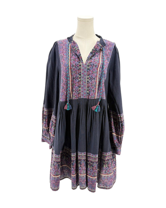 Floral patterned dress on a mannequin against a white background