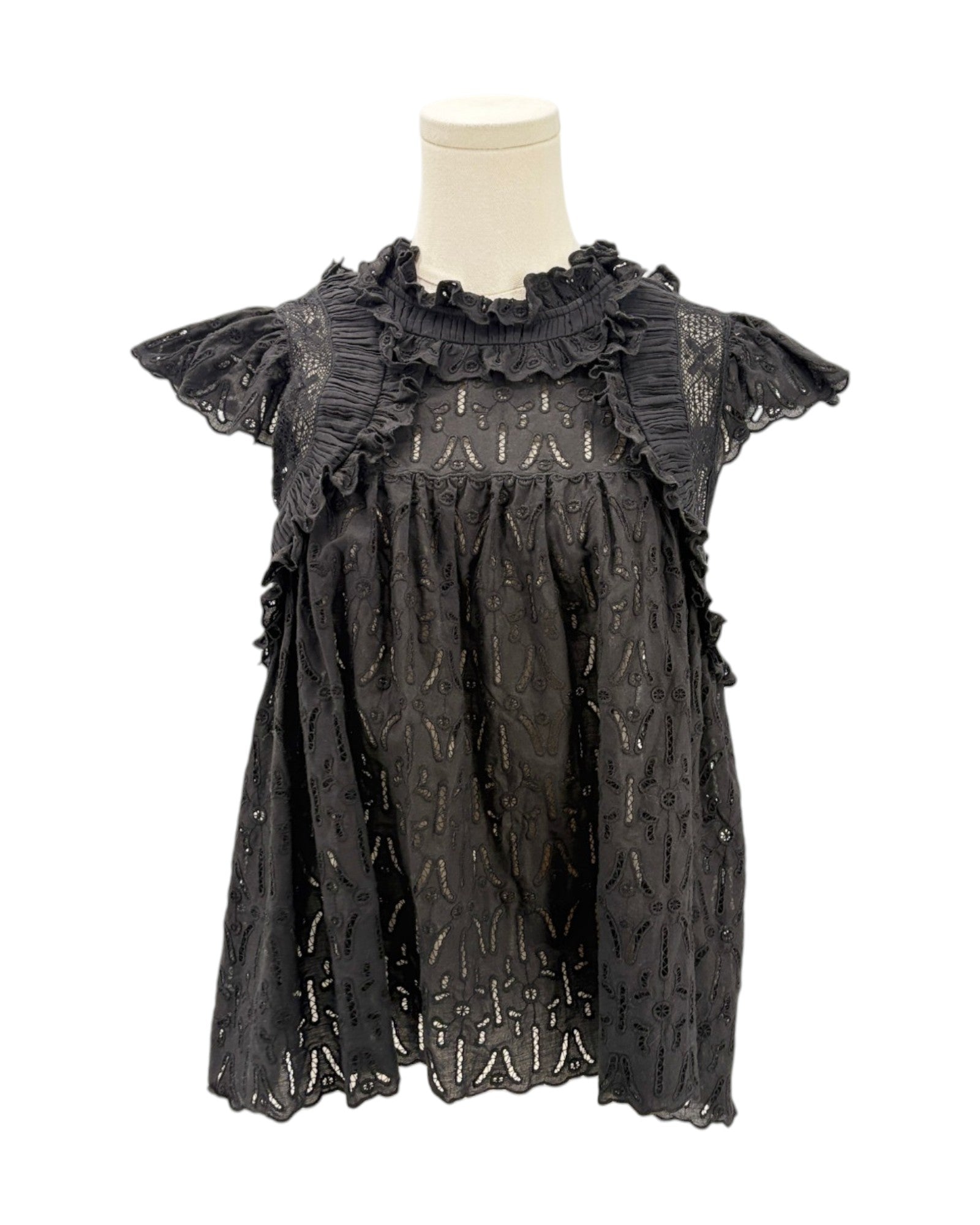 Black lace dress on a mannequin against a white background