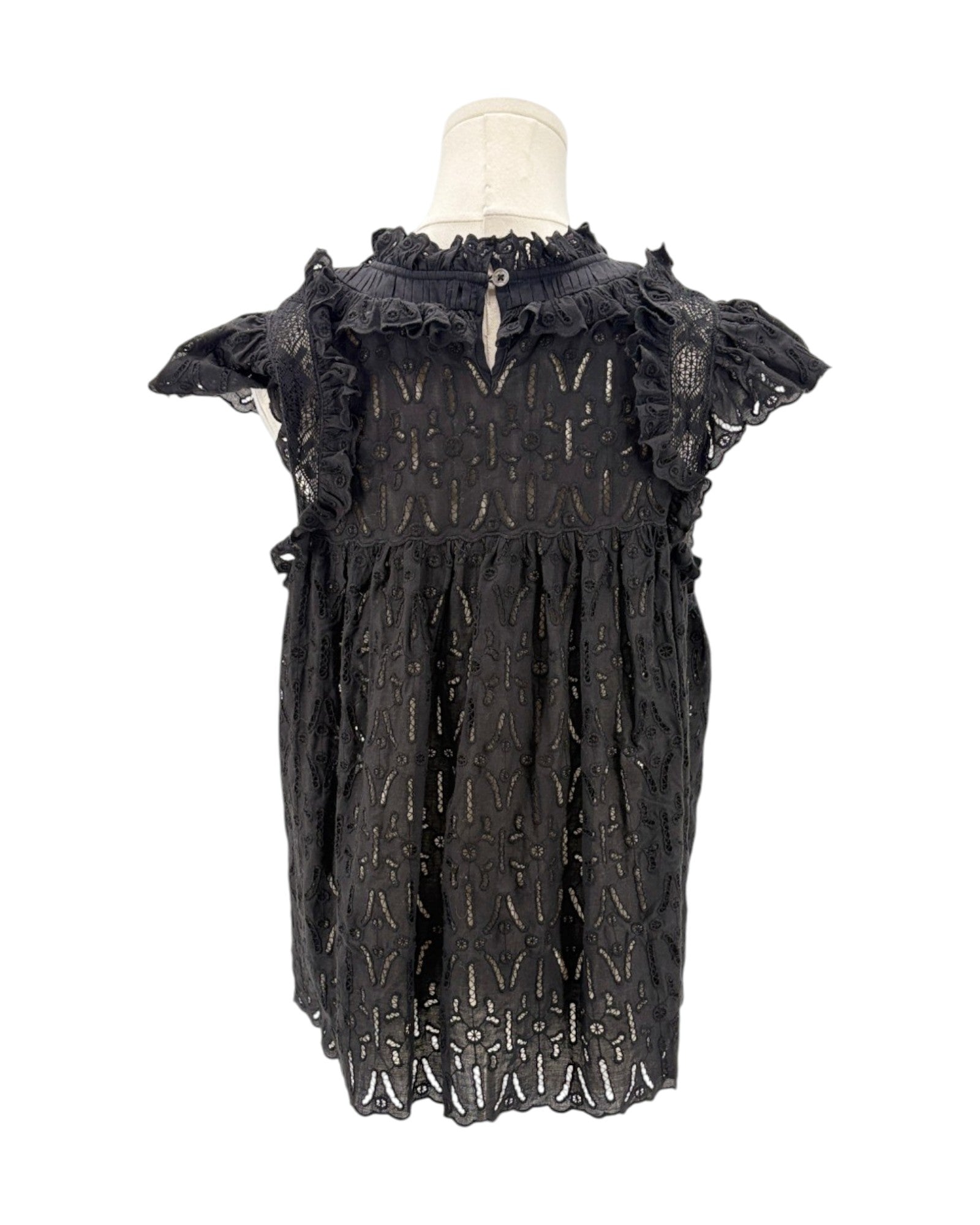 Black lace dress on a mannequin against a white background