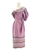 Pink floral dress on a mannequin against a white background