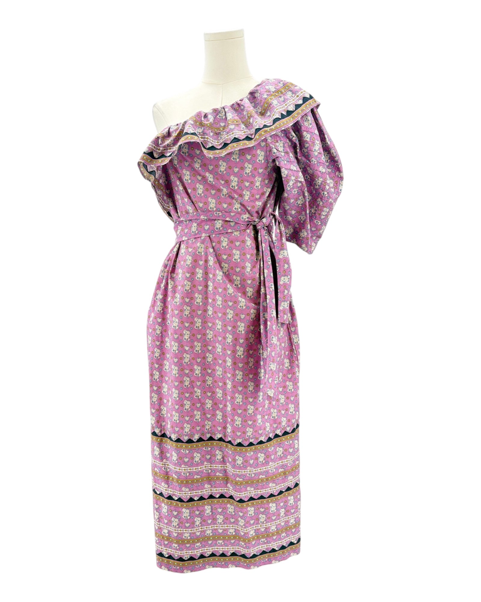 Pink floral dress on a mannequin against a white background