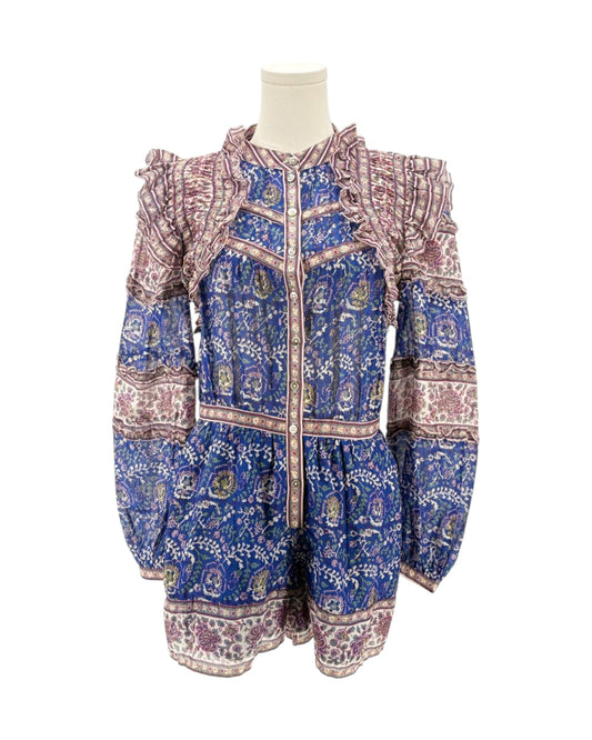 Mannequin wearing a blue and pink patterned jacket on a white background