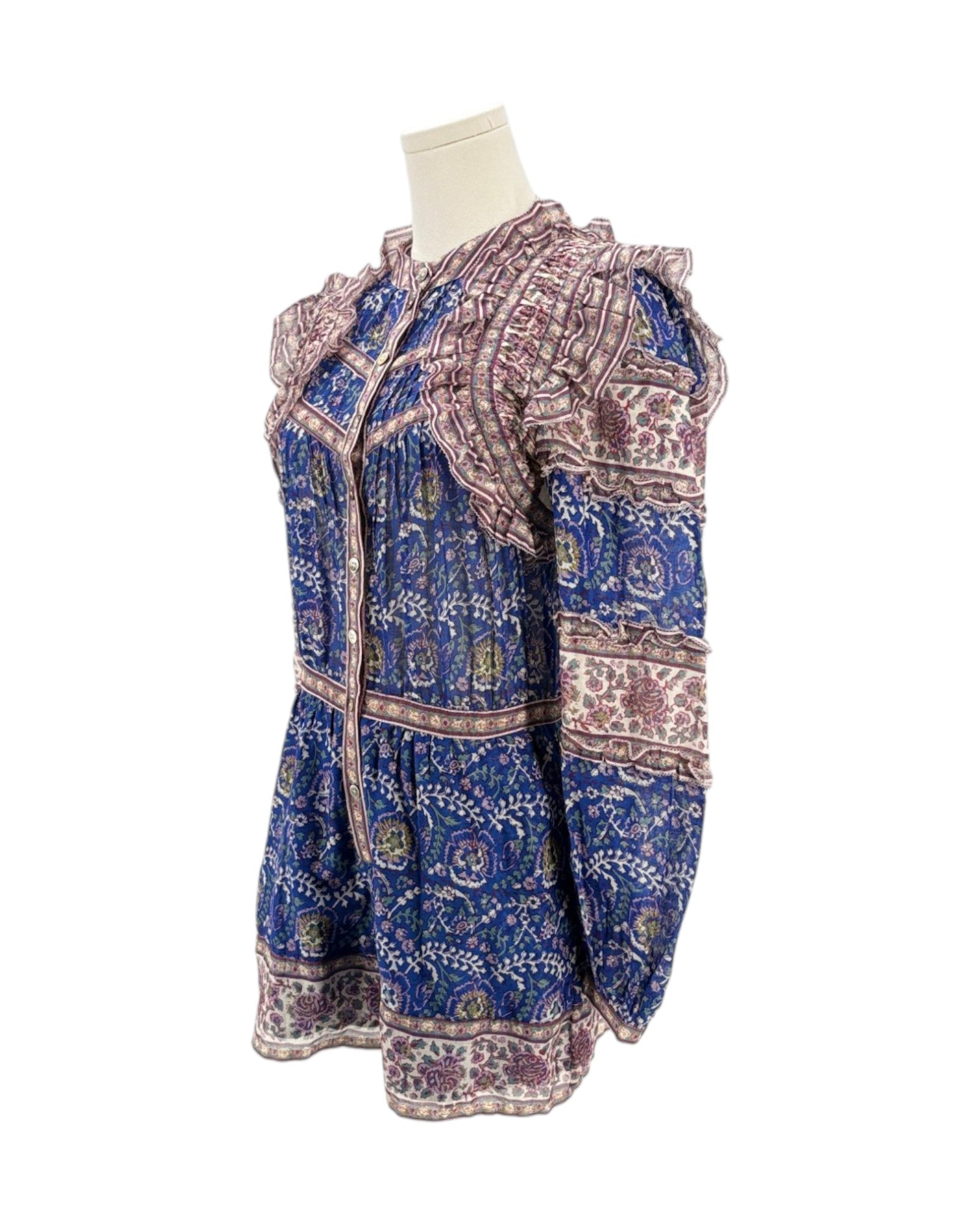Blue and purple patterned dress on a mannequin against a white background