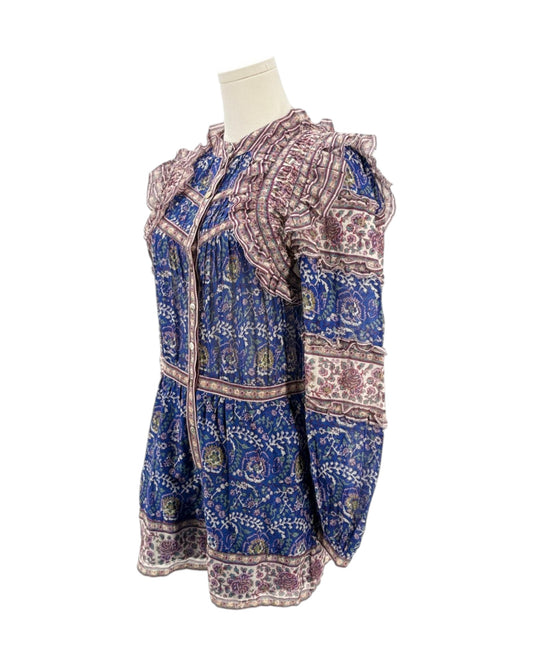 Blue and purple patterned dress on a mannequin against a white background