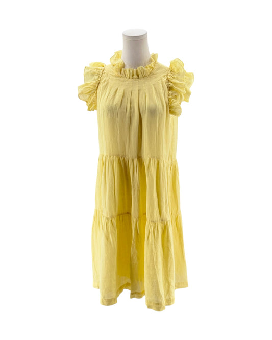Yellow dress on a mannequin against a white background