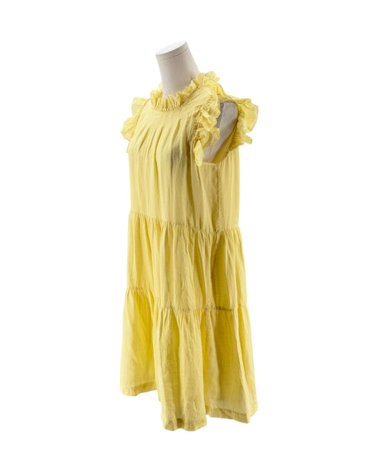 Yellow dress on a mannequin against a white background