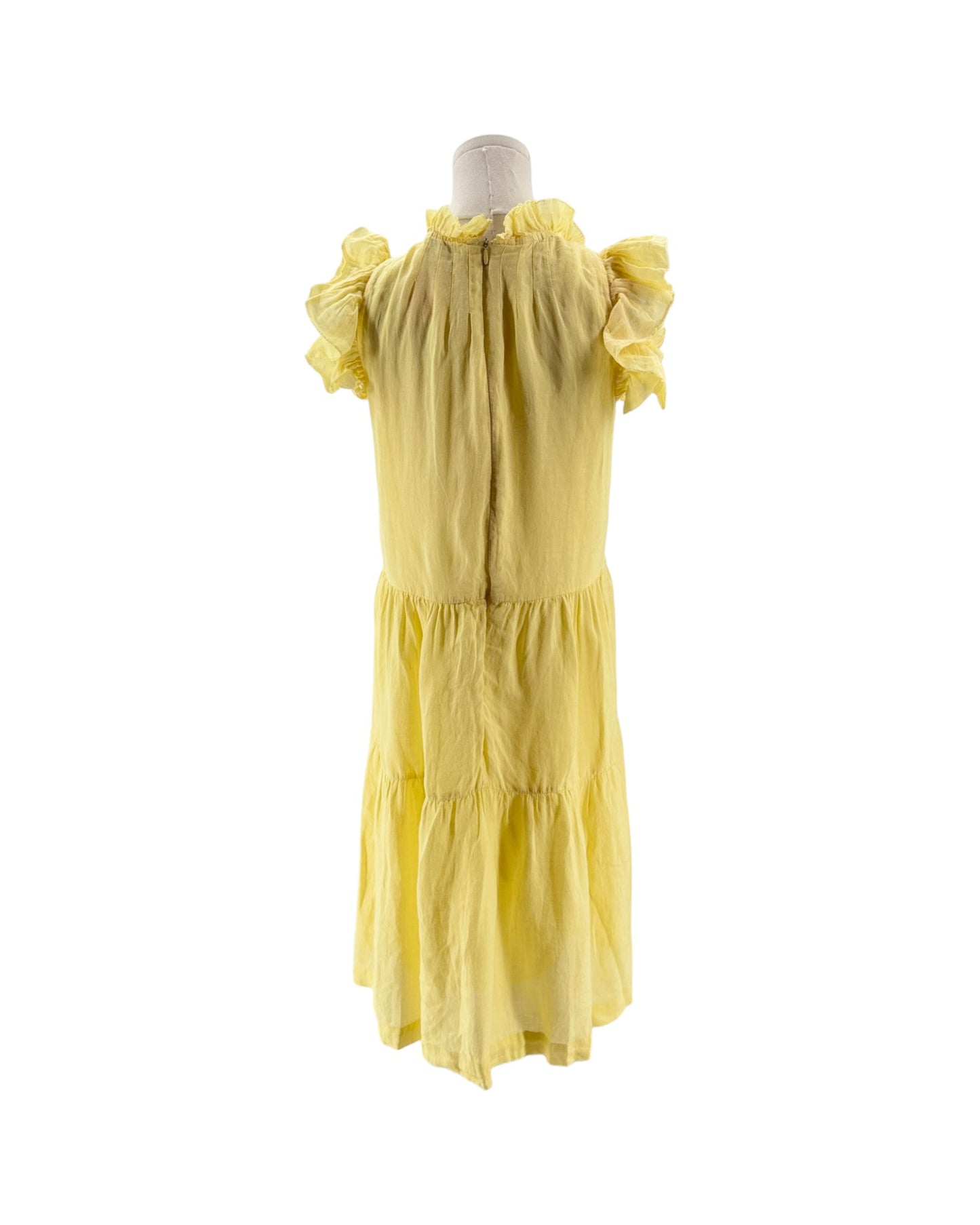 Yellow dress on a mannequin against a white background