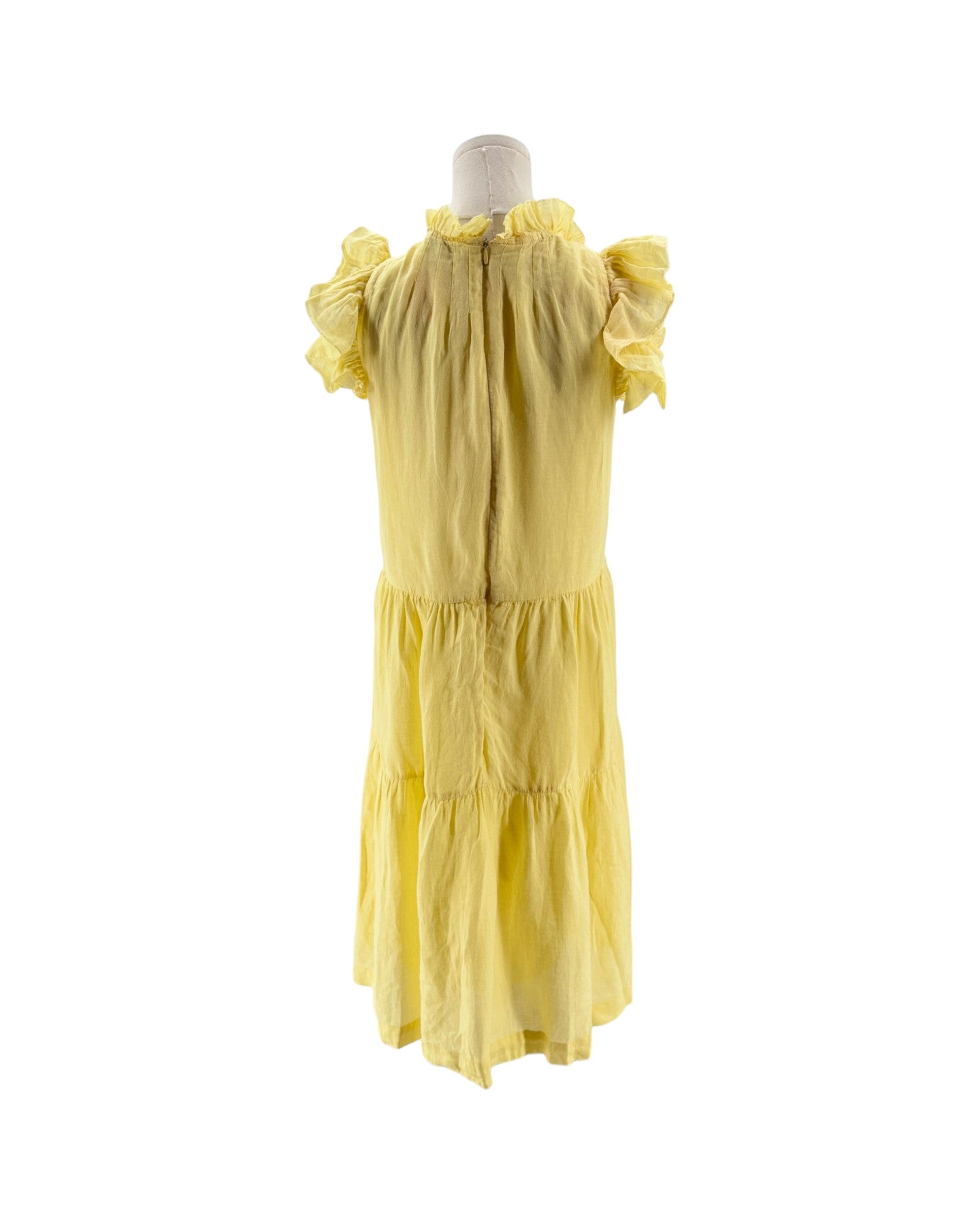 Yellow dress on a mannequin against a white background