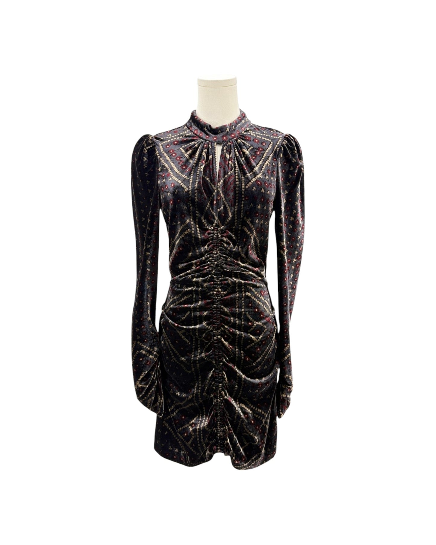 A long-sleeve mini dress in black velvet with shimmering metallic gold and pink glittery patterns, displayed on a mannequin against a plain white background.