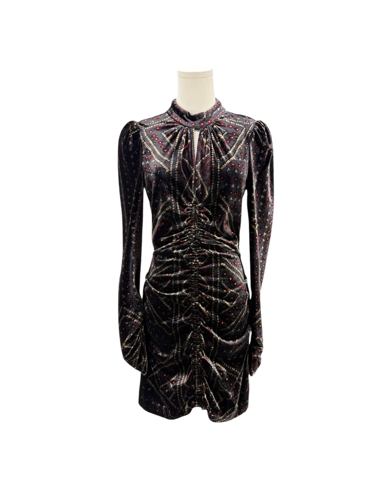 A long-sleeve mini dress in black velvet with shimmering metallic gold and pink glittery patterns, displayed on a mannequin against a plain white background.
