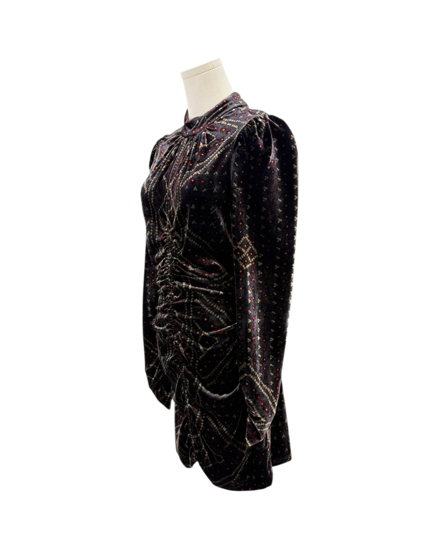 A black velvet long-sleeve blouse with intricate multicolor sequin and bead embroidery, displayed on a mannequin torso against a white background.