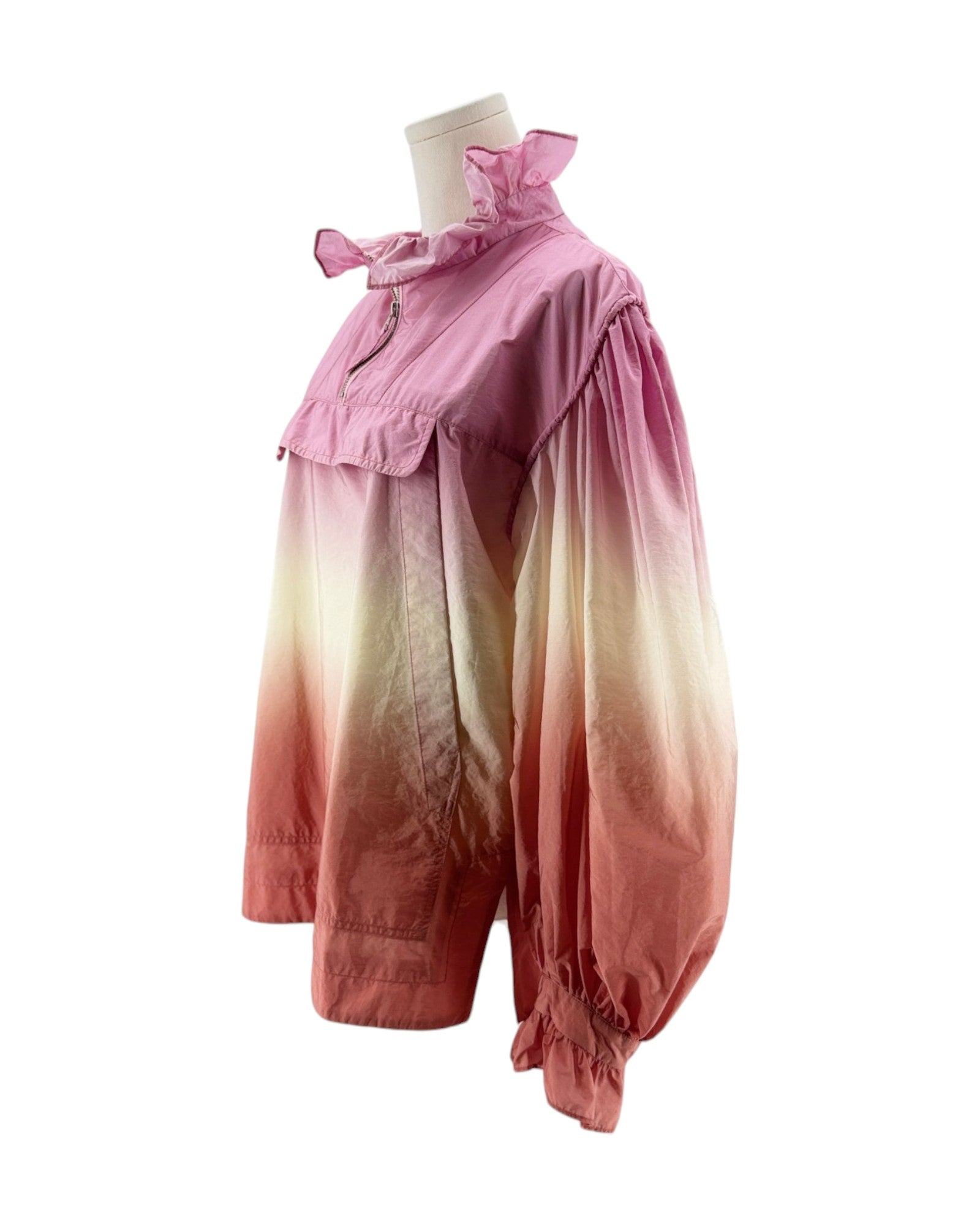 Pink and white gradient dress on a mannequin against a white background