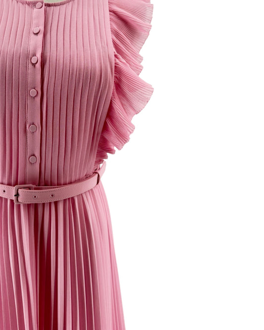 Close-up of a pink pleated dress with a belt on a white background