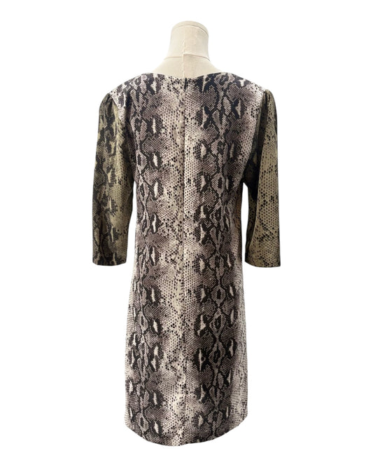Snakeskin pattern dress on a mannequin against a white background