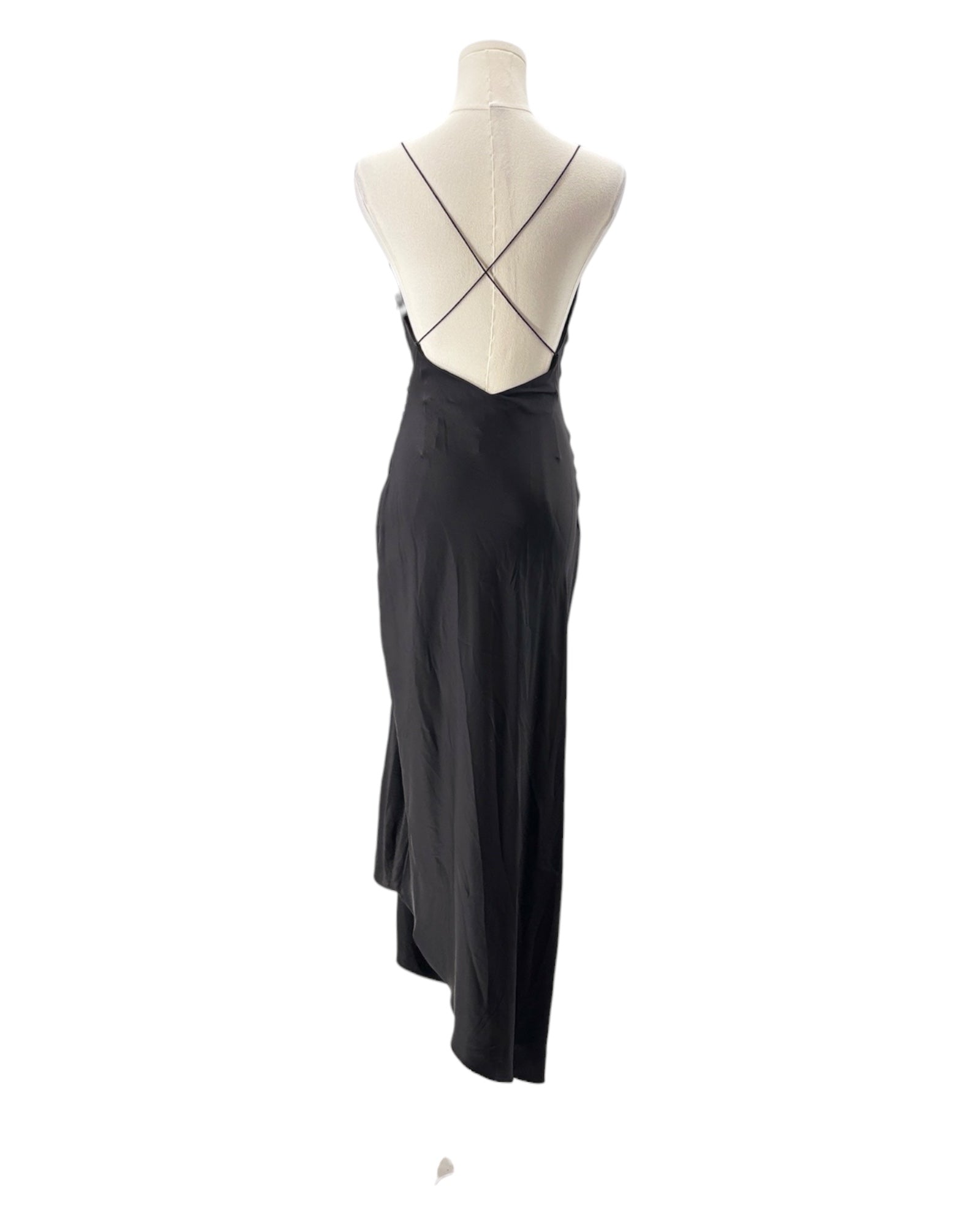 Black evening gown on a mannequin against a white background