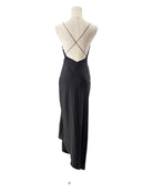 Black evening gown on a mannequin against a white background