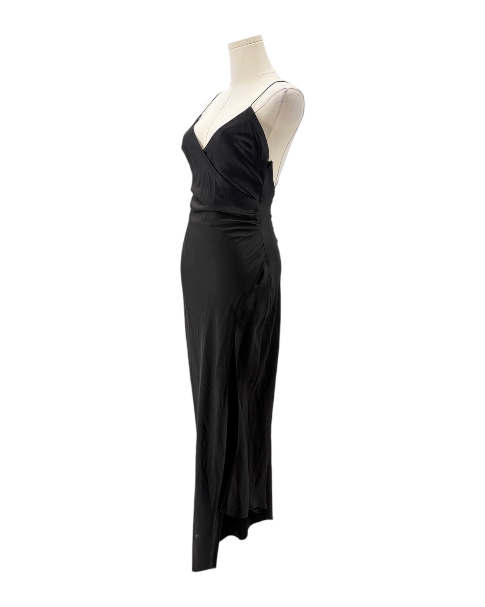 Black evening gown on a mannequin against a white background