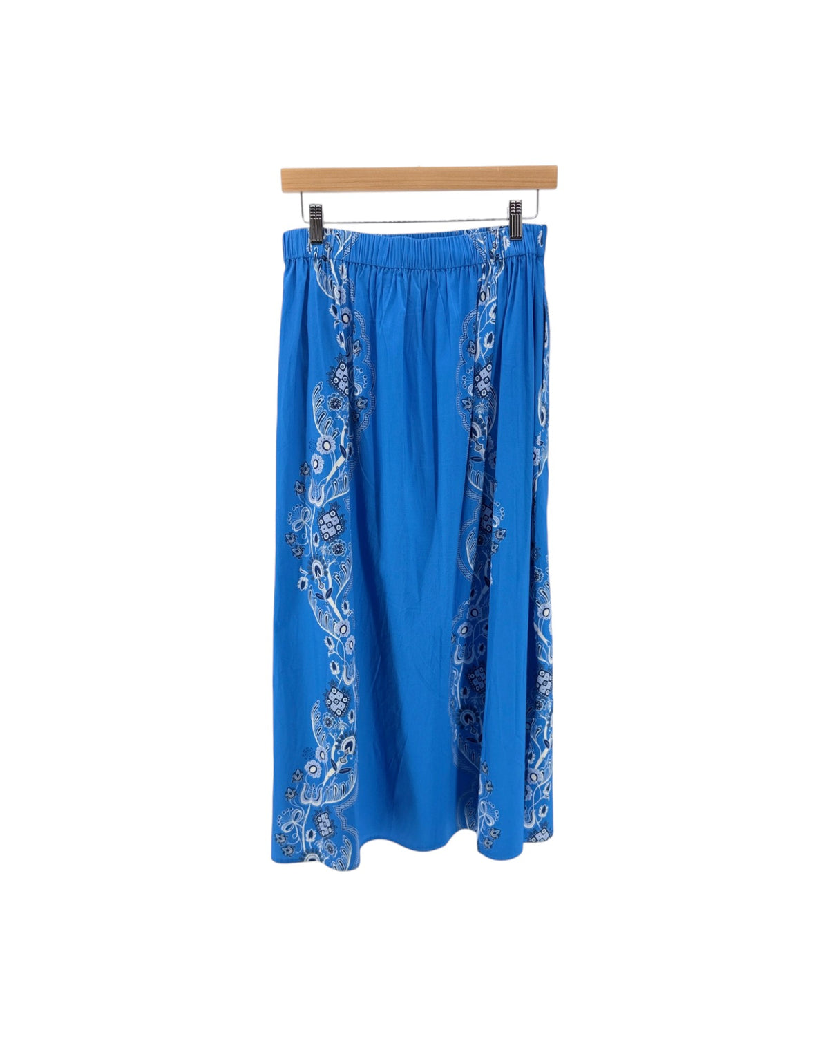 Bright blue midi skirt with a black and white bandana print down the front and sides on a white background